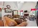 Spacious living room featuring vaulted ceilings, fireplace, and large windows at 3560 Glen Summit Ln, Snellville, GA 30039