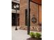 Exterior shot of 'The Well', showcasing its architectural details, sign, and surrounding landscaping at 538 Sawnee Village Blvd # D67, Cumming, GA 30040