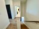 Bright staircase featuring hardwood steps and white banisters connecting upper and lower levels of the home at 538 Sawnee Village Blvd # D67, Cumming, GA 30040