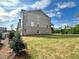 A newly built house with a large yard and brick and neutral siding, perfect for outdoor activities and relaxation at 556 Sawnee Village Blvd # D76, Cumming, GA 30040