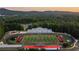 Aerial shot of an outdoor football field with surrounding trees and mountain views at 556 Sawnee Village Blvd # D76, Cumming, GA 30040