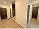 Bright hallway with hardwood floors, neutral walls, and access to multiple rooms in the home at 556 Sawnee Village Blvd # D76, Cumming, GA 30040