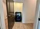 Convenient laundry area with a modern washing machine and easy access from the hallway at 556 Sawnee Village Blvd # D76, Cumming, GA 30040