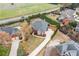Aerial view of landscaped front yard, brick and stone home in a beautiful, established neighborhood at 6730 Waterbury Way, Cumming, GA 30040