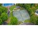 This aerial view showcases well-maintained tennis courts, providing residents with a great opportunity for exercise and friendly competition at 6730 Waterbury Way, Cumming, GA 30040