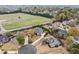 Aerial view of home showing the roof and front and side yards in residential neighborhood at 6730 Waterbury Way, Cumming, GA 30040