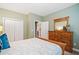 Bedroom with neutral-toned walls, carpeted floors, and spacious closet at 6730 Waterbury Way, Cumming, GA 30040