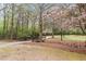 View of a lovely community park featuring walking paths, a quaint gazebo, and lush trees at 6730 Waterbury Way, Cumming, GA 30040