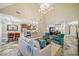 Open-concept living area with direct sight lines into a modern kitchen and formal dining space at 6730 Waterbury Way, Cumming, GA 30040