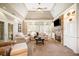 Bright living room with a stone fireplace, built-in bookshelves, and plantation shutters at 6730 Waterbury Way, Cumming, GA 30040