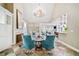 Elegant living room boasts a fireplace, built-in cabinets, and a view of the open floor plan at 6730 Waterbury Way, Cumming, GA 30040
