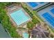 This aerial view showcases the pool and the tennis courts at 6730 Waterbury Way, Cumming, GA 30040