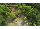 Aerial view of the property within a large, treed lot at 806 Jefferson Sw Ct, Conyers, GA 30094