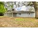 Back exterior view featuring a screened porch at 806 Jefferson Sw Ct, Conyers, GA 30094