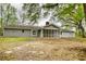 Back exterior view featuring a screened porch at 806 Jefferson Sw Ct, Conyers, GA 30094