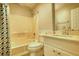 Well-lit bathroom features a shower-tub combo, vanity, and a coordinated mirror, offering a functional space at 806 Jefferson Sw Ct, Conyers, GA 30094
