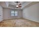 Spacious bedroom featuring a ceiling fan, a window with blinds, and neutral-toned walls at 806 Jefferson Sw Ct, Conyers, GA 30094
