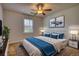 Cozy bedroom with a ceiling fan, neutral walls, and coordinated furnishings for a relaxing atmosphere at 806 Jefferson Sw Ct, Conyers, GA 30094