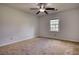 Neutral bedroom with a ceiling fan and natural light from the window creates a calming atmosphere at 806 Jefferson Sw Ct, Conyers, GA 30094
