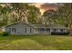 Charming single-story home with light-blue siding, a white front porch, and a well-maintained front yard at 806 Jefferson Sw Ct, Conyers, GA 30094