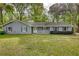 Charming single-story home with light-blue siding, a white front porch, and a well-maintained front yard at 806 Jefferson Sw Ct, Conyers, GA 30094
