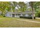 Charming single-story home with light-blue siding, a white front porch, and a well-maintained front yard at 806 Jefferson Sw Ct, Conyers, GA 30094