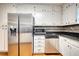 Kitchen with stainless steel appliances, white cabinetry, and granite countertops at 806 Jefferson Sw Ct, Conyers, GA 30094