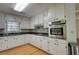 Charming kitchen with stainless steel appliances and ample white cabinetry at 806 Jefferson Sw Ct, Conyers, GA 30094