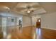 Open living room with wood floors, tray ceiling, and convenient access to other living spaces at 806 Jefferson Sw Ct, Conyers, GA 30094