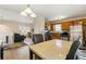 Open concept kitchen and eat-in area showcasing stainless steel appliances and natural light at 313 Daniel Mill Xing, Villa Rica, GA 30180