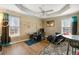 A living room features a drum set, windows, and minimal decorations at 313 Daniel Mill Xing, Villa Rica, GA 30180