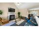 Comfortable living room features a fireplace, modern furniture, and TV at 313 Daniel Mill Xing, Villa Rica, GA 30180