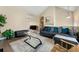 Inviting living room with glass coffee table, plush seating, and neutral color palette at 313 Daniel Mill Xing, Villa Rica, GA 30180