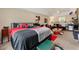 Large main bedroom with a seating area, complemented by neutral walls and soft lighting at 313 Daniel Mill Xing, Villa Rica, GA 30180
