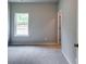 Bedroom featuring neutral carpet, one window, and light-grey walls at 3904 Shelleydale Dr, Powder Springs, GA 30127