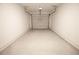 Clean, empty garage with white walls and a concrete floor, ready for parking and storage at 530 Sawnee Village Blvd # D63, Cumming, GA 30040