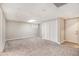 Finished carpeted basement with drop ceiling, and doors with white trim at 647 Sunshine Nw Trce, Acworth, GA 30102