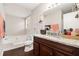 Bathroom featuring a bathtub, granite countertops, wood cabinets, and a mirror at 647 Sunshine Nw Trce, Acworth, GA 30102