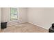 Small carpeted bedroom with a window at 647 Sunshine Nw Trce, Acworth, GA 30102
