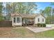 Charming single-Gathering home featuring a cozy front porch and a well-manicured lawn at 647 Sunshine Nw Trce, Acworth, GA 30102