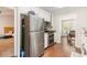 Kitchen with stainless steel refrigerator and view into dining room at 647 Sunshine Nw Trce, Acworth, GA 30102