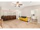 Open-concept living room with neutral walls, carpet flooring, and seamless flow to the dining area at 647 Sunshine Nw Trce, Acworth, GA 30102