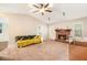 Inviting living room with a cozy fireplace, plush carpet, and ample natural light at 647 Sunshine Nw Trce, Acworth, GA 30102