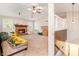 Cozy living room with a brick fireplace, plush carpet, and a view of the split level stairs at 647 Sunshine Nw Trce, Acworth, GA 30102