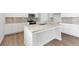 Modern kitchen featuring granite countertops, stainless steel appliances, and a spacious island at 7194 Brushwood Bend - Lot 116, Lithonia, GA 30058
