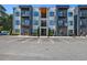 Modern apartment building featuring private balconies, clean architectural lines, and ample parking at 1155 Custer Se Ave # 209, Atlanta, GA 30316