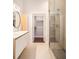 Modern bathroom with double sinks, glass shower, and large closet at 1155 Custer Se Ave # 209, Atlanta, GA 30316