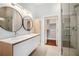 Modern bathroom with double sinks, glass shower, and large closet at 1155 Custer Se Ave # 209, Atlanta, GA 30316