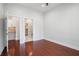 Bedroom featuring hardwood floors with views into the kitchen and closet at 1155 Custer Se Ave # 209, Atlanta, GA 30316
