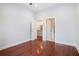Bedroom with dark hardwood floors, two doors opening to the kitchen and bathroom at 1155 Custer Se Ave # 209, Atlanta, GA 30316